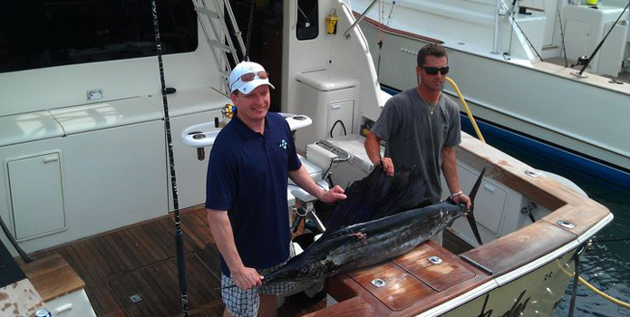 boynton beach sailfish behind charter boat