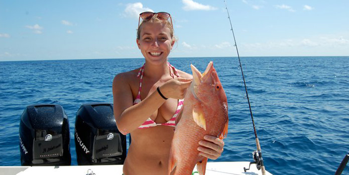 Girl catches a snapper in Florida